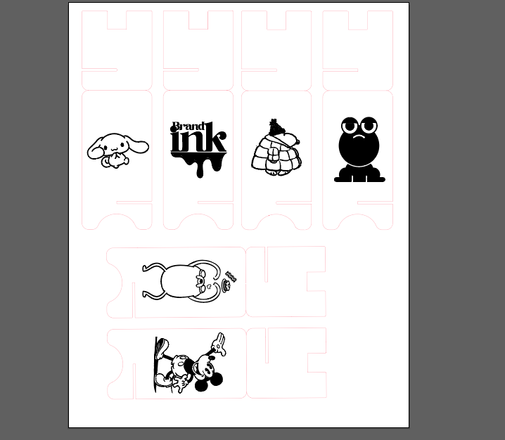 A full sheet of laser-cut phone-stand components is arranged with engraved cartoon graphics and brand motifs placed inside individual panel cutouts.